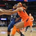 The Connecticut Sun's Kristine Anigwe, front, and the Lynx's Karima Christmas-Kelly chase after a loose ball during the second half of a game last sea