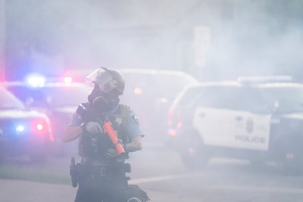 Minneapolis Police used tear gas to break up a protest outside the Fifth Precinct after the 8 p.m. curfew on May 30.