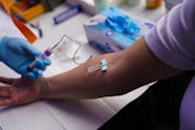 In San Diego, an employee takes a blood test to determine if he carries coronavirus antibodies.
