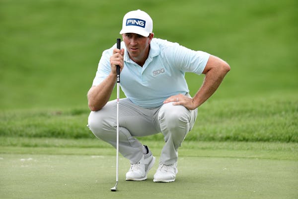 Michael Thompson looks over a putt on the 12th green during the third round of the 3M Open