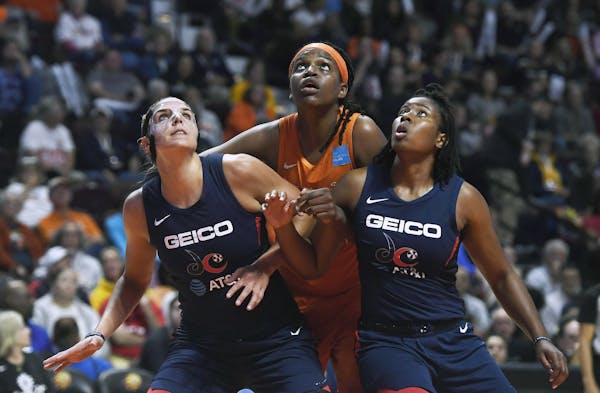 Connecticut’s Jonquel Jones, center, and Washington’s Elena Delle Donne, left, are among the players expected to miss this season.