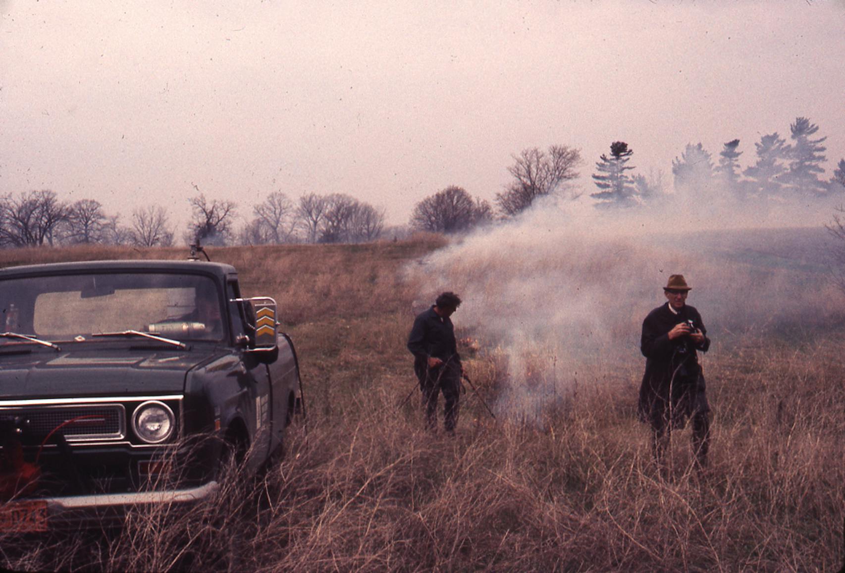 Prairie burns are part of the growth process, taking away nonnative species and trees and allowing for healthier growth. Shown is a burn at Crow Hassan in the late 1960s, before they were formalized and had strict safety protocols.