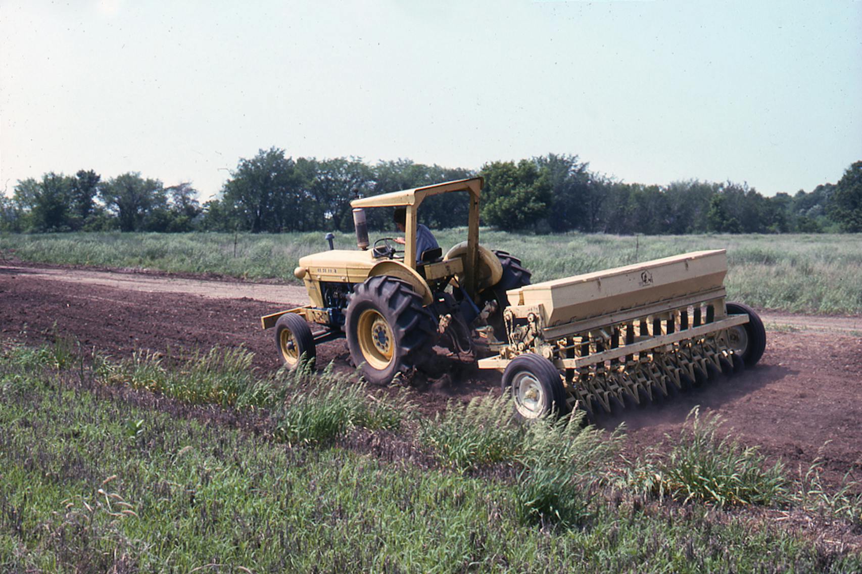 Prairie seed planting using the first Truax seed drill in the 1970s at Crow Hassan Park Reserve.
