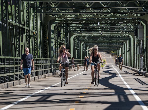 Bikers crossed the historic Stillwater Lift Bridge, now exclusively for pedestrians and bikers. Finally connected by a historic bridge and opened to t