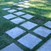 Concrete pavers create a path from the Hammonds’ house to outlying spaces on the lot, including the play area.