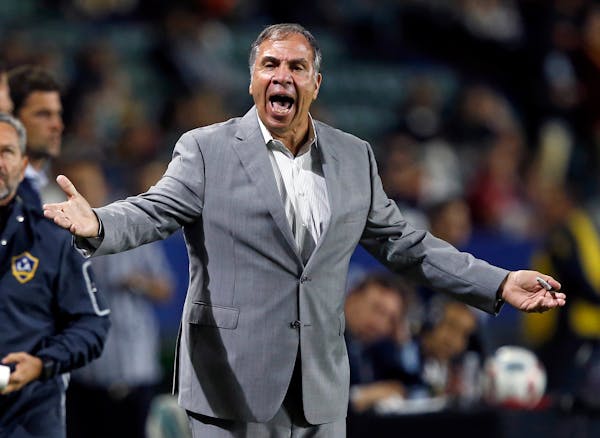 FILE - In this Oct. 26, 2016, file photo, Los Angeles Galaxy head coach Bruce Arena yells at the side judge during the first half of a knockout round 