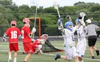 Eagan's Brandon Wuertz celebrated after scoring a second-half goal in the Wildcats' 19-12 victory over Benilde-St. Margaret's for the boys' lacrosse s