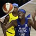 Lynx center Sylvia Fowles reached for the ball in front of Chicago Sky guard Diamond DeShields during the first half of an WNBA game Thursday in Brade