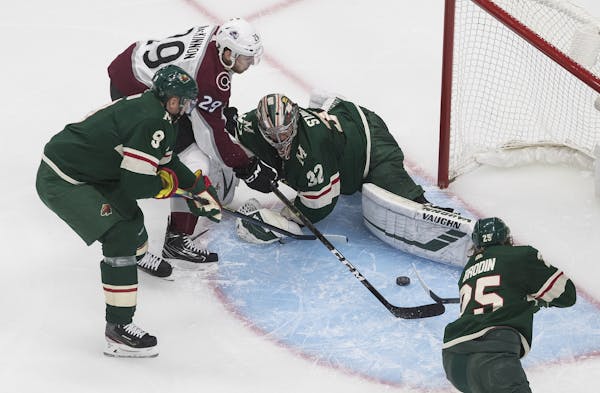 Nathan MacKinnon (29) of the Avalanche was stopped by Wild goalie Alex Stalock on Wednesday.
