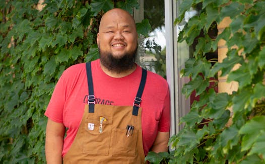 Yia Vang stands in front of the new location for his forthcoming brick-and-mortar restaurant, Vinai, which celebrates food from his family‘s Hmong heritage.