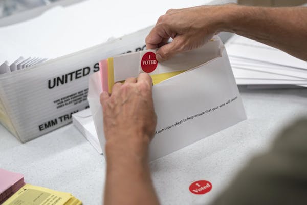 Todd Gallagher prepared mail-in ballots in July in Minneapolis.
