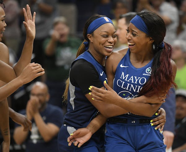 Minnesota Lynx guard Odyssey Sims (1) celebrated with guard Lexie Brown (4) during a game las season.