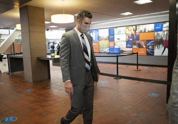 Former police officer Thomas Lane walks through security as he arrived for a hearing at the Hennepin County Government Center in Minneapolis on July 2