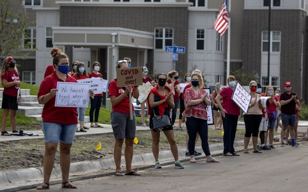In August, Anoka-Hennepin teachers rallied ahead of a school board meeting at Sandburg Education Center in Anoka.