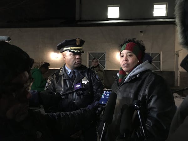 Minneapolis Police Chief Medaria Arradondo and Chauntyll Allen, an organizer with Black Lives Matter Twin Cities, spoke at a community holiday tree er