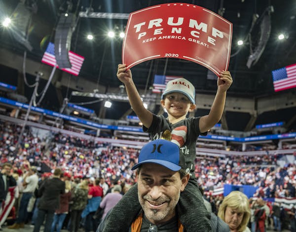 Andre Springer with son Michael, 3, rallied for President Donald Trump at Target Center in Minneapolis last October.