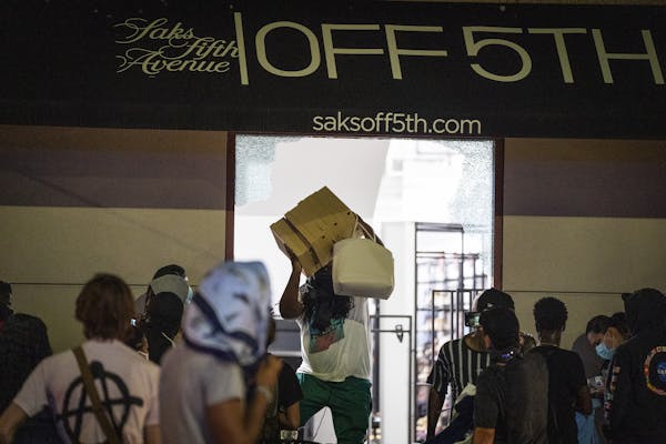 Crowds looted the Saks Fifth Avenue Off Fifth store in downtown Minneapolis on Wednesday, Aug. 26, after a report of a man’s death on Nicollet Mall.
