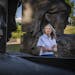 Mary Ceruti, executive director of Walker Art Center, in the Minneapolis Sculpture Garden with Mark Manders’ sculpture “September Room.” Photo b