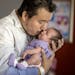 Juan Duran-Gutierrez kissed his newborn baby girl Andrea for the first time in his home after bringing her home from North Memorial Health Hospital.