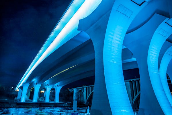 The I-35W bridge in Minneapolis glowed in light blue on April 9, 2020, to honor healthcare providers and essential workers. Other landmarks and buildi