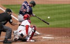 Minnesota Twins' Josh Donaldson (24) hits a three-run home run during the third inning in the first game of a baseball doubleheader against the St. Lo
