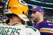 Vikings quarterback Kirk Cousins, right, met Green Bay’s Aaron Rodgers after a 23-10 Packers victory last Dec. 23.