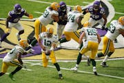 Packers quarterback Aaron Rodgers handed the ball off to Aaron Jones in the fourth quarter.
