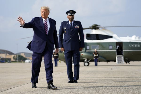 President Donald Trump waves as he boards Air Force One for a campaign rally in Bemidji, Minn., Friday, Sept. 18, 2020, in Andrews Air Force Base, Md.