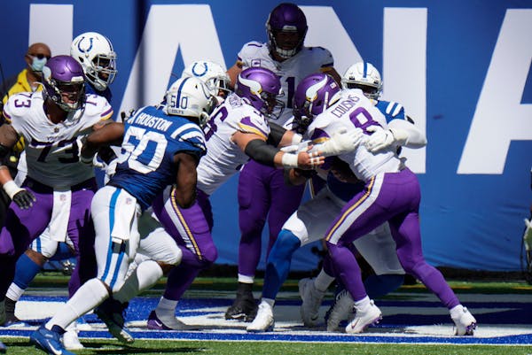 Vikings quarterback Kirk Cousins is sacked by Indianapolis Colts' DeForest Buckner (99) for a safety in the second quarter.