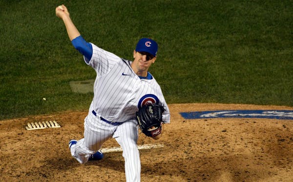 Cubs starting pitcher Kyle Hendricks delivers against the Twins during the fifth inning