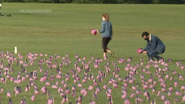 Flags planted in DC to mark grim virus milestone