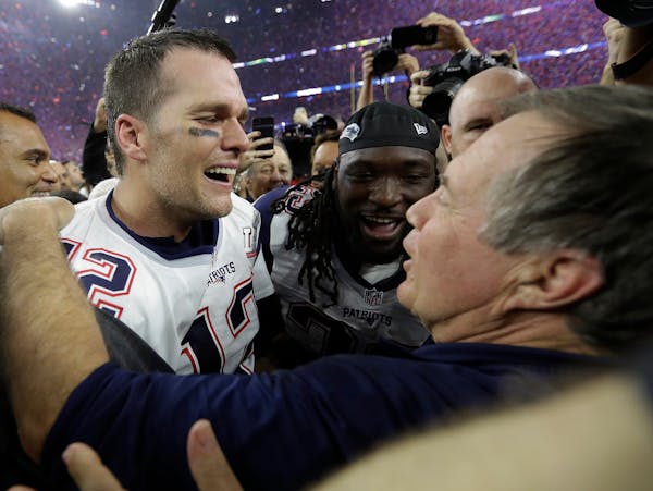 New England Patriots' Tom Brady celebrates with head coach Bill Belichick after winning the NFL Super Bowl 51 football game against the Atlanta Falcon