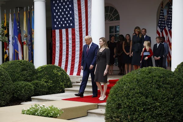 Judge Amy Coney Barrett walks from the Oval Office to be introduced by President Donald Trump as his Supreme Court Associate Justice nominee in the Ro