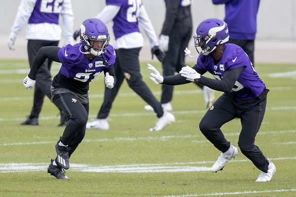 Vikings cornerback Mike Hughes, left, at a recent practice.