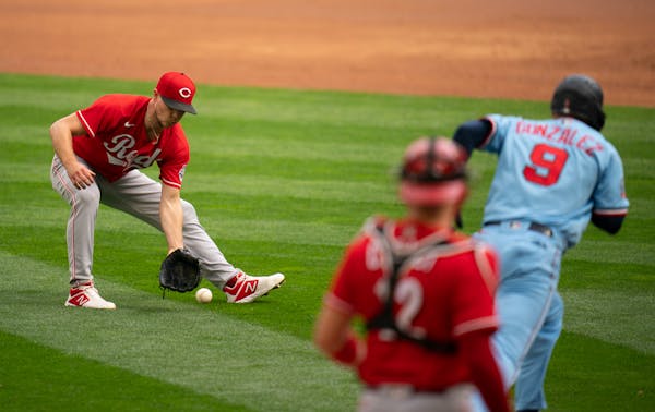Reds pitcher Sonny Gray fielded a third inning grounder by Twins third baseman Marwin Gonzalez