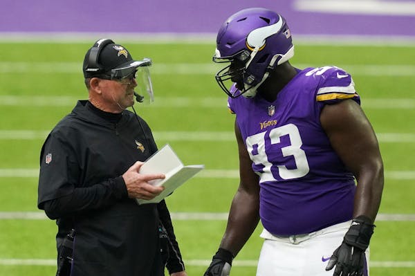 Vikings coach Mike Zimmer, above with DT Shamar Stephen, said it’s taking little longer this season for his players to grasp what he wants.