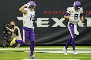 Vikings receiver Adam Thielen (19) and quarterback Kirk Cousins celebrated after they connected on a pass for a touchdown Sunday in Houston.