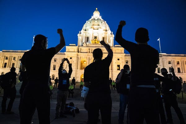 Families of those killed by police marched with hundreds of supporters to the Capitol in St. Paul on Thursday night.