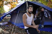 Brandon Harrison, 35, celebrated his birthday at a homeless encampment in Logan Park with his girlfriend Nichol Wyandt, 43, this week.