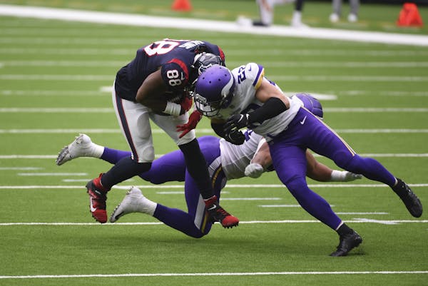 Eric Christian Smith • Associated Press Vikings safety Harrison Smith, right, was ejected for this hit on Texans tight end Jordan Akins on Sunday.