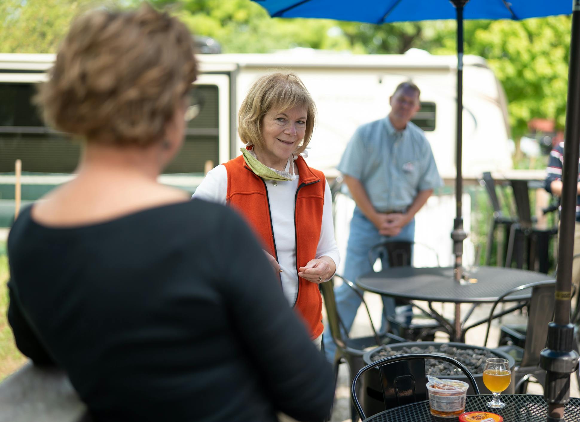 Sen. Tina Smith talked with co-owner Tracie Vranich as she visited Chapel Brewing in Dundas, Minn.