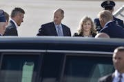 Supporters, including Republican Senate Majority Leader Paul Gazelka, left, and his wife Maralee, meet President Donald Trump as he arrived at Minneap
