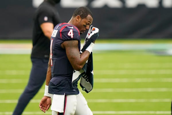 Houston Texans quarterback Deshaun Watson (4) walks off the field after the team's loss to the Vikings.