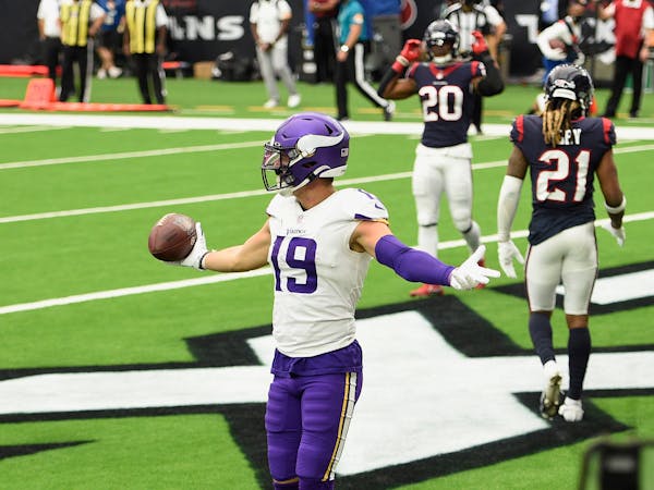 Vikings wide receiver Adam Thielen (19) celebrates after a touchdown catch against the Houston Texans during the second half.