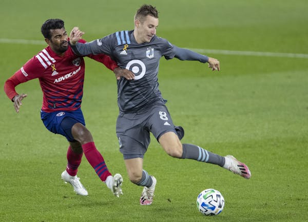 Thiago Santos (5) of Dallas FC and Jan Gregus of Minnesota United FC fought for the ball last month at Allianz Field.