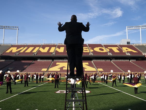 Assistant director Lance Sample conducted the marching band performing at TCF Bank Stadium. The show will be aired on YouTube and Facebook.