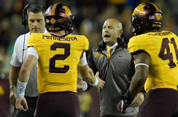 Gophers coach PJ Fleck celebrated with quarterback Tanner Morgan after a second quarter touchdown in 2019.