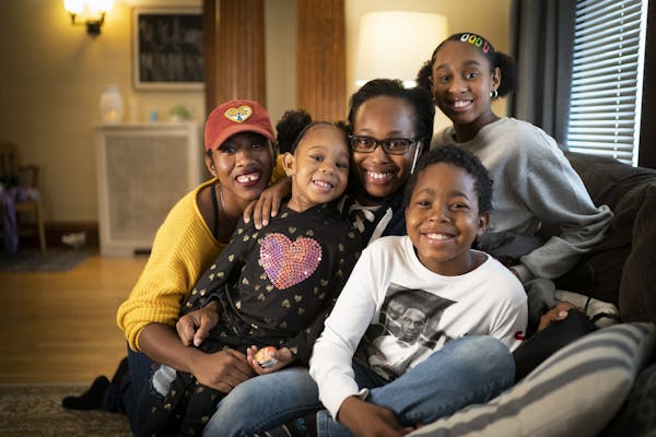 Staff Sgt. Farrah Kennedy, center with glasses, was photographed with her children Rayesha Kennedy, Frankie Higgins, Rayshawn Higgins and Ahkirrah Col