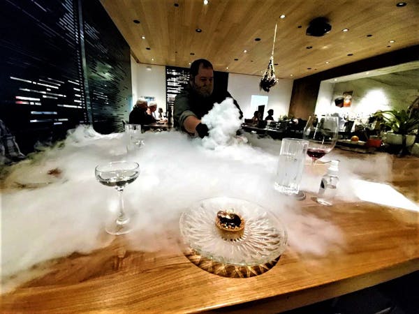 Chef Mike Brown makes a smoky effect for the dessert course at Travail's new multi-course tasting dinner, A New Hope.