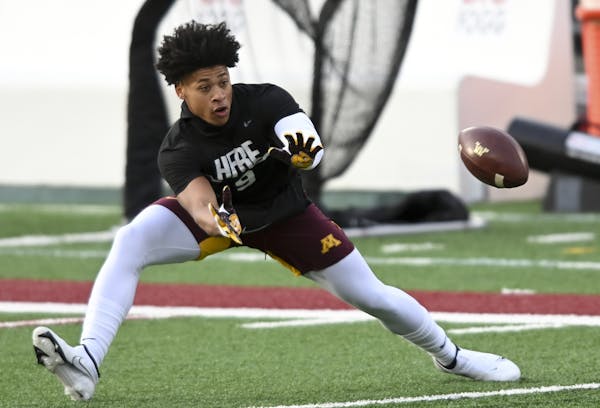 Gophers freshman receiver Daniel Jackson warmed up before Friday’s game against Maryland, then followed it up with his first career reception.